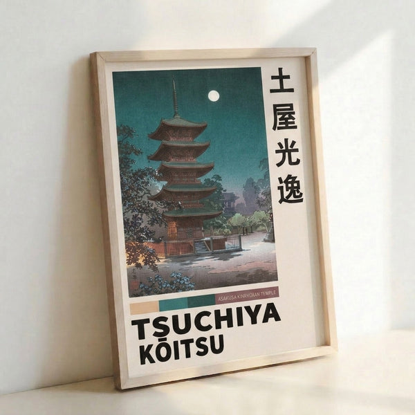 Tsuchiya Koitsu's contemplative woodblock design depicting a moonlit sacred pagoda with cream and green palette, displayed as framed wall art.