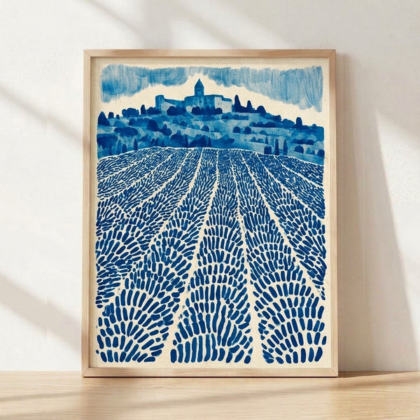 Vintage watercolor landscape of rolling lavender fields in Provence with a distant church steeple, rendered in soft navy blue, sky blue, and cream tones on a framed poster.
