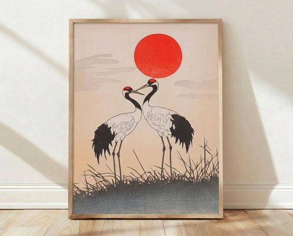 Minimalist Japanese woodblock-inspired poster featuring two red crown cranes in flight before a rising sun, rendered in bold black lines with cream and gray-blue accents.