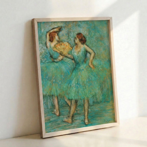 Framed poster artwork depicting two dancers in classical pose, featuring soft blended colors and the loose, atmospheric quality of Impressionist painting.