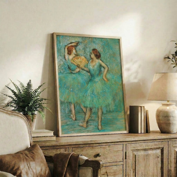 Vintage-style framed poster showing two dancers in graceful interaction, painted in soft impressionistic tones of cream, gray, and warm ochre.