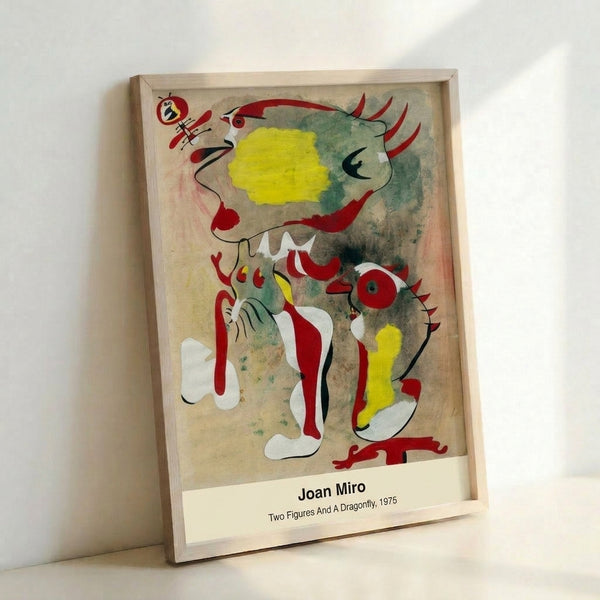Abstract surrealist artwork depicting two figures alongside a dragonfly in minimalist style using red, blue, yellow, and black elements on a clean white surface.