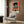 Psychologically intense abstract composition of two twisted figures with a monkey in red, cream, brown, and black; framed modern art print with profoundly unsettling character.