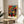 Surrealist modern art print showcasing gestural black shapes and warm ochre lines against cream background with meditative abstract composition.