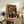 Framed modernist print with whimsical abstract forms in red, blue, and black ink, showcasing the playful approach of classic pochoir technique.