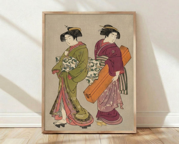 Framed Japanese woodblock print depicting two serene geishas in ornate kimonos featuring olive green, burgundy, and rose pink tones, rendered in elegant vintage ukiyo-e style.