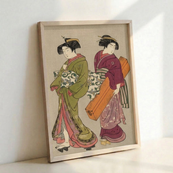 Two geishas in elaborate kimonos with intricate patterns in muted olive, rose, and warm cream tones, captured in serene traditional Japanese woodblock print style on framed poster.