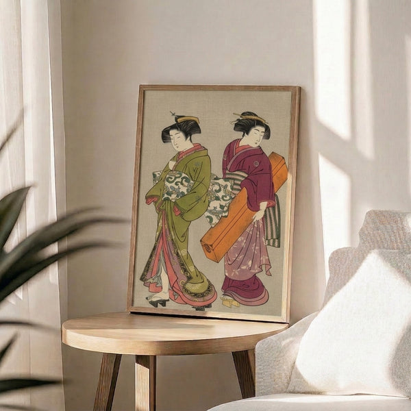 Framed vintage ukiyo-e print featuring two serene geishas in richly detailed kimonos colored with warm oranges, deep burgundy, olive green, and delicate rose tones in traditional Japanese style.