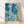 Framed cyanotype poster of a serene ocean reef scene with flowing jellyfish, kelp, and coral in deep blue and teal tones, rendered in Japanese woodblock style.