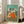 Framed Impressionist dance scene with dancers in bold red and yellow costumes, loose brushwork style evoking movement and theatrical elegance.