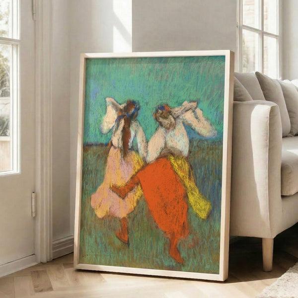 Framed Impressionist dance scene with dancers in bold red and yellow costumes, loose brushwork style evoking movement and theatrical elegance.