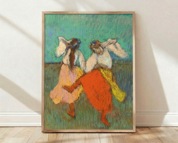 Impressionist painting of ballet dancers in flowing red and yellow skirts, captured in graceful poses with soft ochre and pale blue tones, framed as wall art.