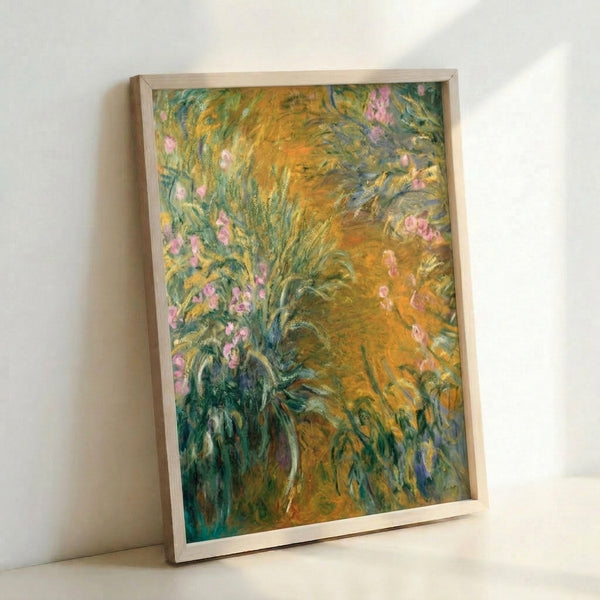 Framed garden wall art depicting flowering bushes in soft impressionist style with subtle blended hues and peaceful atmosphere.