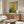 Garden-inspired framed artwork of blooming flower bushes in impressionist style with gentle color harmonies and serene mood.