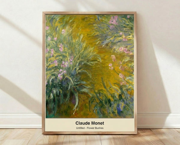 Impressionist painting of flowering bushes and trees in soft greens, whites, and ochre tones, framed poster hanging on a wall in a serene garden scene.