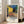 Van Gogh Cafe Terrace at Night poster displaying a luminous street café with tables, figures, and buildings in golden and blue hues, a classic Impressionist composition.