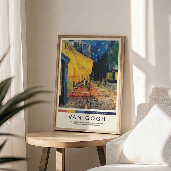 Vintage-style framed print of Van Gogh's atmospheric nighttime café, featuring warm cream and yellow tones against deep blue skies with stars and architectural details.
