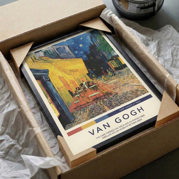 Van Gogh's celebrated Cafe Terrace at Night in warm cream, gold, and blue tones, an Impressionist vision of Parisian nightlife hung as a framed art poster.