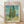 Framed poster of Van Gogh's 1889 Cypresses landscape featuring swirling brushstrokes in turquoise, sage green, and golden yellow depicting tall cypress trees against a dynamic sky.