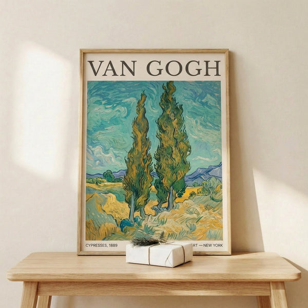 Framed vintage landscape artwork featuring cypress trees rendered in characteristic Post-Impressionist style with turquoise and blue swirling sky, contemplative and dynamic.