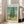 Museum-quality poster of Van Gogh's cypress study showcasing expressive impasto technique in sage, golden, and turquoise hues across a mountainous landscape.