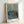 Dark academia wall art showing Van Gogh's 1890 painting of men exercising in prison yard, featuring earthy ochre and teal hues with melancholic, thoughtful character.