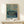 Impressionist poster art framing Van Gogh's study of human confinement and routine, prisoners and guards in brick courtyard rendered in muted sage, dusty blue, and cream.