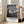Framed poster of the iconic Starry Night painting with its characteristic swirling atmosphere, pale cream and yellow stars punctuating a rich blue evening sky.