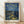 Impressionist framed poster of a starry night sky over a river with luminous stars and crescent moon, rendered in deep blues and bright yellows with olive and purple tones.