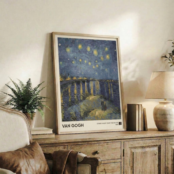 Romantic impressionist print of a starlit night overlooking a town and river, with swirling yellow stars and a glowing sky in shades of blue, purple, and olive.