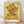 Van Gogh Sunflowers 1889 framed poster featuring a vibrant arrangement of golden and burnt orange blooms in a vase, rendered in warm impressionist brushstrokes.