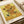 Framed Van Gogh Sunflowers print showcasing the artist's masterful use of golden and warm earth tones to capture the essence of blooming flowers in a vase.