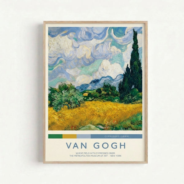Framed Van Gogh-inspired art print featuring a turbulent wheat field with emerald green cypresses and slate gray mountains beneath an expressive, wind-swept sky.