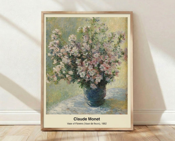 Framed impressionist watercolor poster of a delicate vase of flowers in soft pink, lavender, and cream tones with golden highlights, creating a serene and luminous mood.