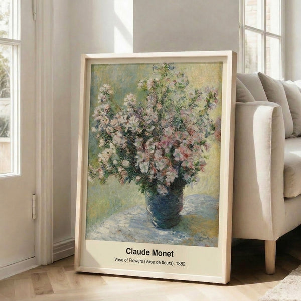 Framed poster displaying an impressionist floral composition with a vase in gentle pink, lavender, cream, and green tones, exuding serene, ethereal beauty.