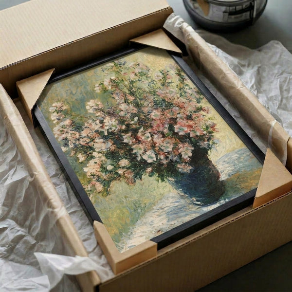 Framed print of an elegant floral still life in Monet's impressionist manner, featuring a vase of blooms in harmonious pastel and neutral tones.