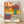 Abstract cut-out poster with vibrant crimson, emerald, and ochre vegetable shapes arranged in a playful, minimalist composition inspired by Matisse's distinctive style.