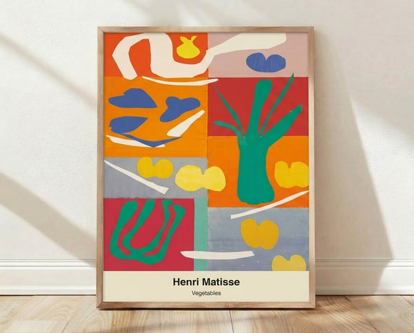 Abstract cut-out poster with vibrant crimson, emerald, and ochre vegetable shapes arranged in a playful, minimalist composition inspired by Matisse's distinctive style.