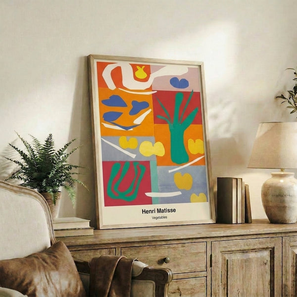 Abstract wall art poster with whimsical vegetable shapes rendered in bold, saturated colors—emerald, azure, ochre, and crimson—in a minimalist cut-out style.