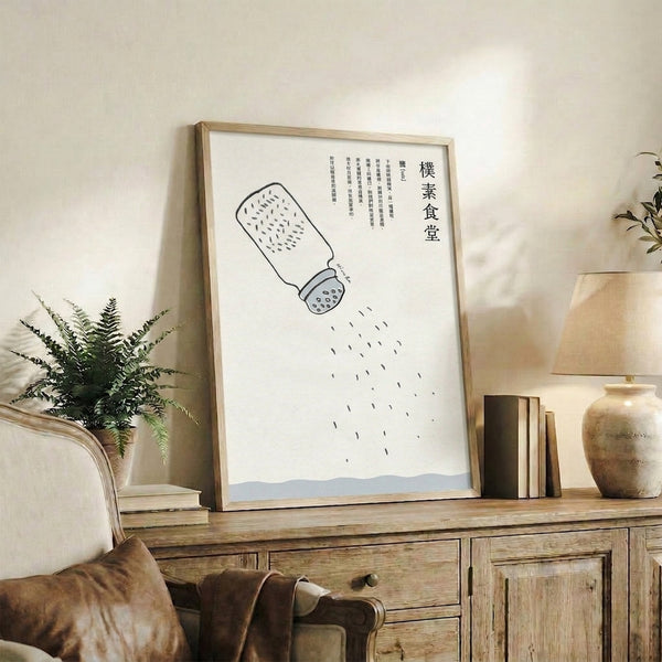Framed minimalist line art featuring a solitary salt shaker with whimsical falling elements, monochromatic black lines on warm cream with blue-gray accents.