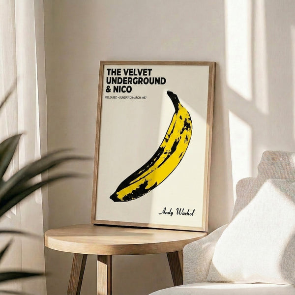 Pop art wall decoration featuring a yellow banana rendered in flat, graphic style against a contrasting backdrop, retro album cover inspired.