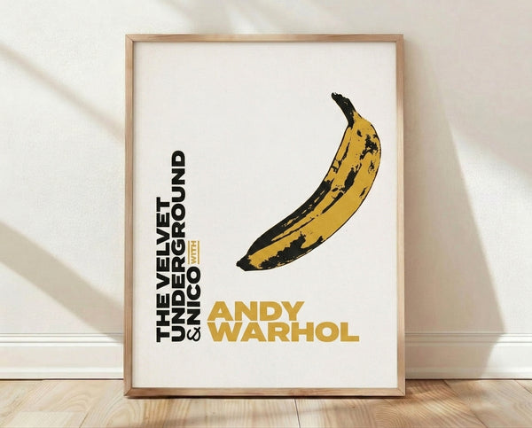Bold yellow banana on cream background in iconic pop art style, framed poster celebrating Warhol's Velvet Underground aesthetic.
