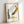 Framed pop art poster featuring a simplified banana in vibrant yellow tones against neutral cream, epitomizing 1960s avant-garde design.