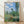 Monet's serene 1880 Impressionist landscape depicting a poppy field with a village church tower and poplars under golden light, framed as a wall art print.