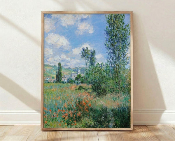 Monet's serene 1880 Impressionist landscape depicting a poppy field with a village church tower and poplars under golden light, framed as a wall art print.