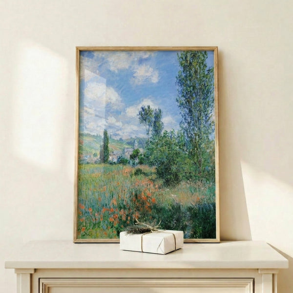 Impressionist masterpiece capturing a sunlit poppy field with rolling greens, a church tower, and atmospheric golden tones in this 1880 Vetheuil composition.