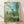 Impressionist landscape painting of Vetheuil with soft brushstrokes depicting a serene riverside village in warm and cool tones, framed as wall art.