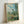 Framed impressionist masterpiece featuring Vetheuil's peaceful riverside scene with luminous palette of blues, greens, and warm accents characteristic of 1880s French art.