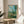 Impressionist artwork depicting the tranquil town of Vetheuil along the water with delicate light effects and naturalistic color palette, displayed as a framed print.