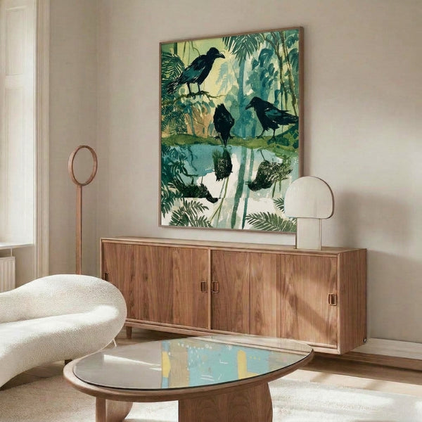 Framed art print showing two black ravens at a wetland pond with lush vegetation in muted sage and teal hues, evoking a contemplative vintage aesthetic.